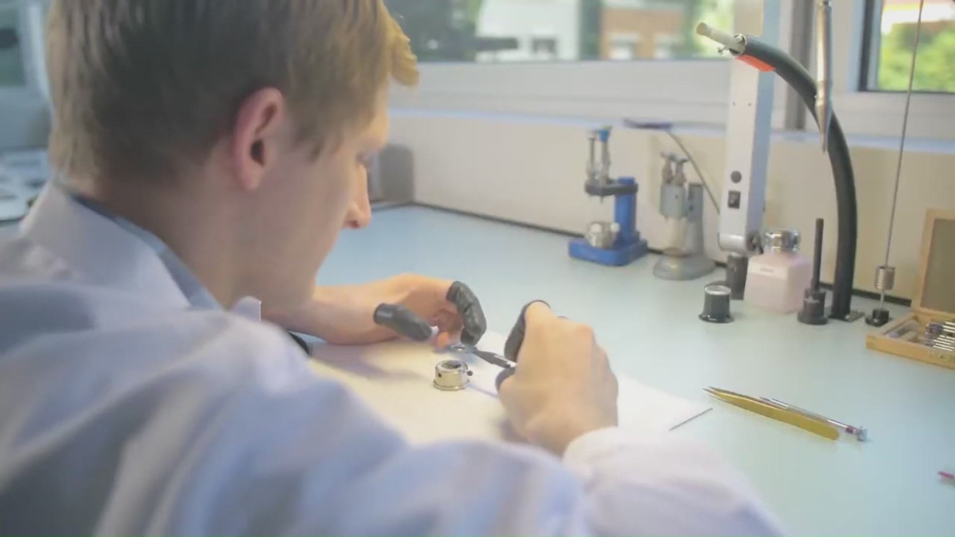 Load video: Swiss watch maker assembling a watch in his lab